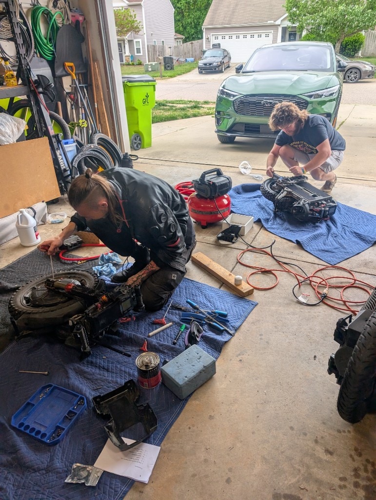 Technicians servicing electric unicycles at PEV Portal in Mebane, North Carolina